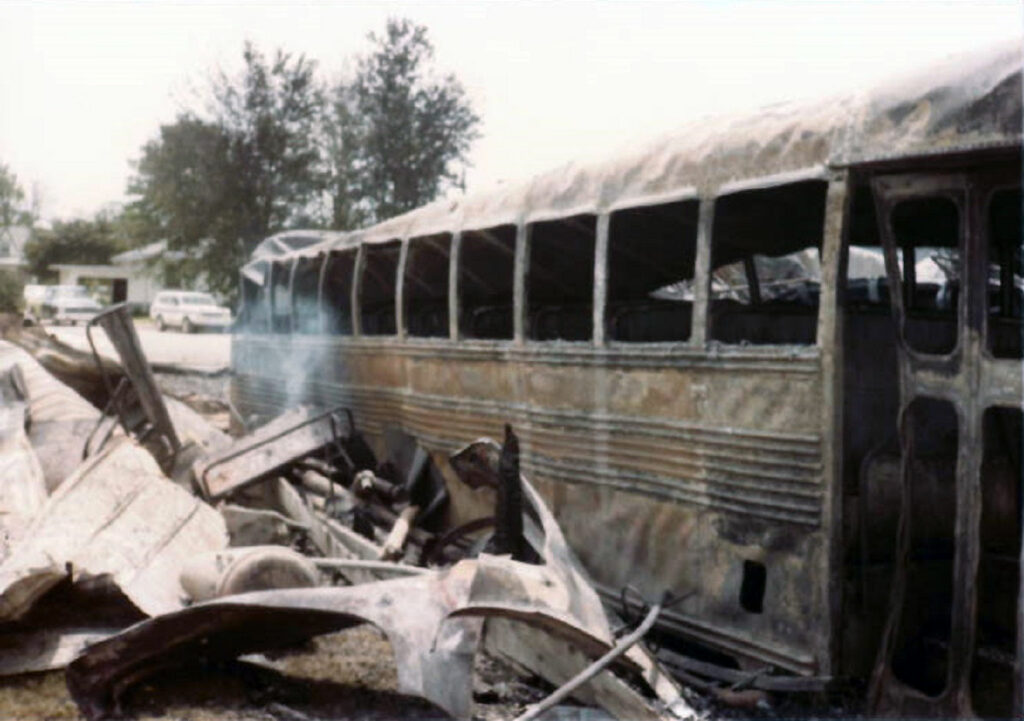 a bus that was burned from a building fire